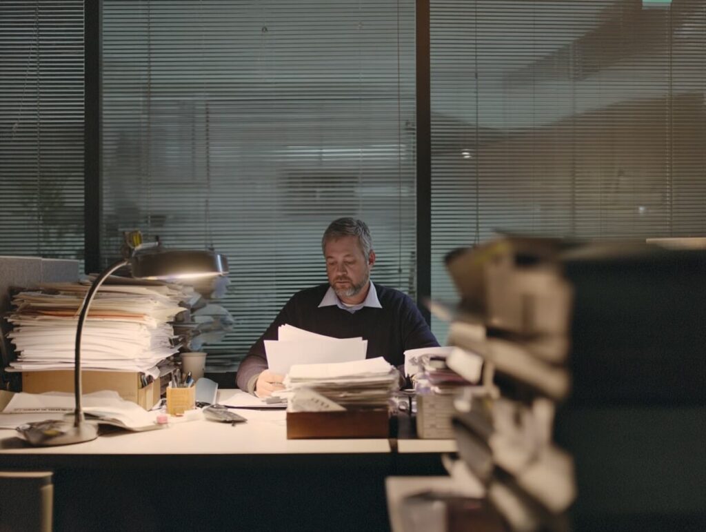 Exec with paperwork at desk